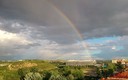 Arco IRis sobre caja mágica del trnnis